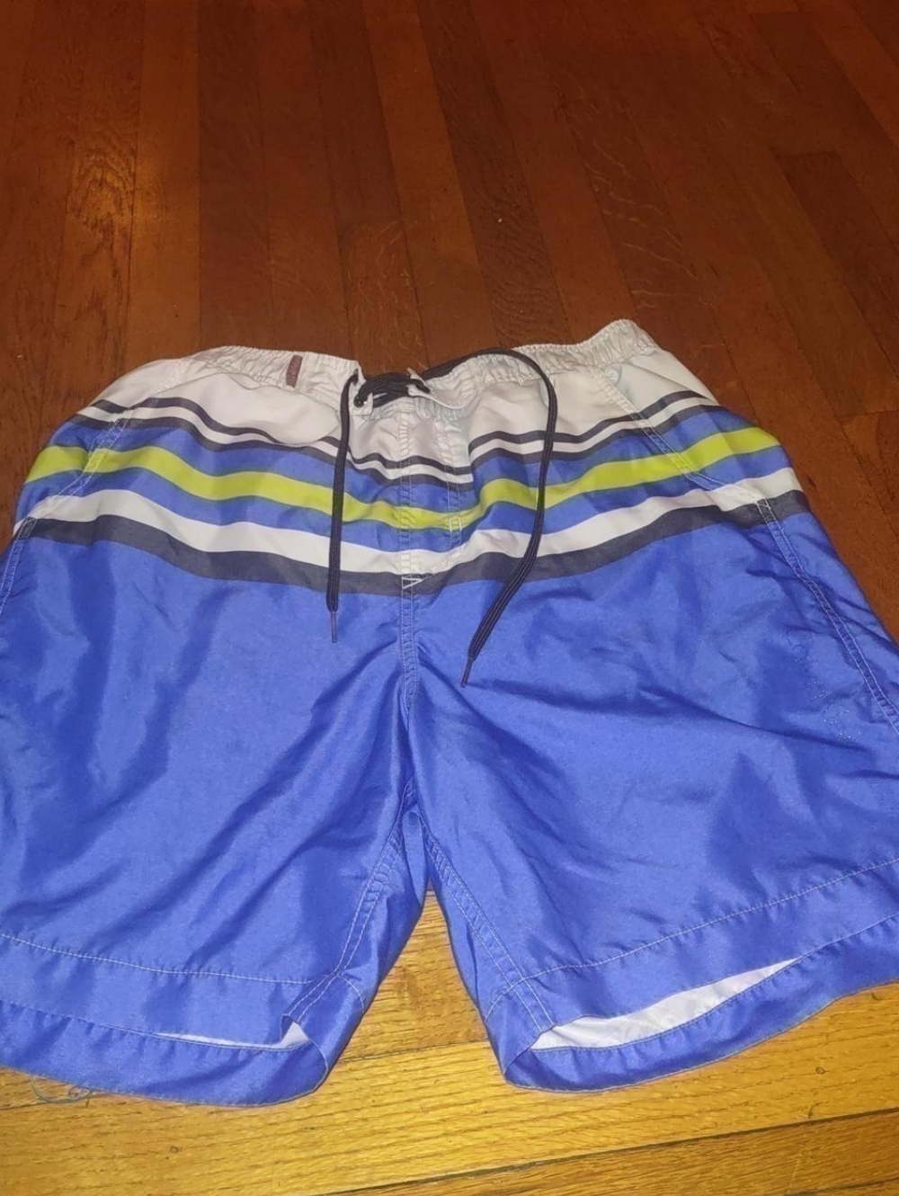 blue swim trunks with white and green accent from Calvin Klein size Large